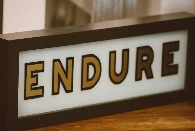 Framed sign that states "endure".